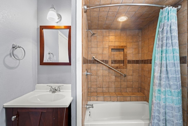 bathroom featuring vanity and shower / bathtub combination with curtain