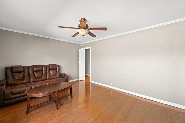 living room with ceiling fan, ornamental molding, and hardwood / wood-style flooring