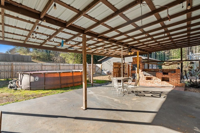 view of patio featuring a fenced in pool