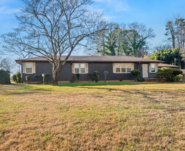 ranch-style house with a front lawn