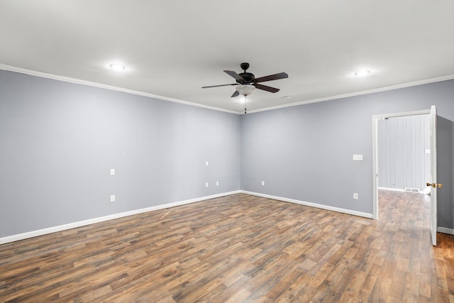 spare room with crown molding, ceiling fan, and dark hardwood / wood-style floors