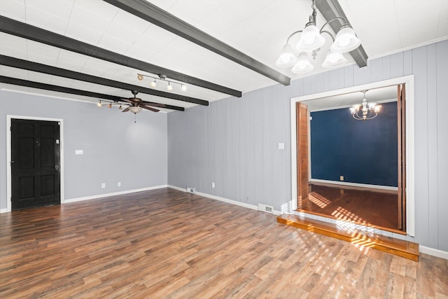 unfurnished living room with beamed ceiling, wood-type flooring, and ceiling fan with notable chandelier