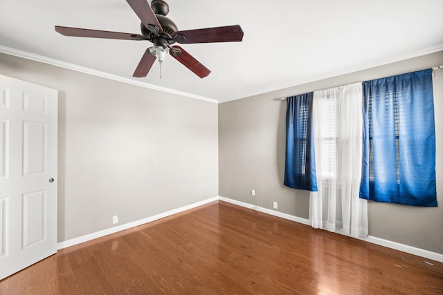 unfurnished room featuring hardwood / wood-style floors, ceiling fan, and crown molding