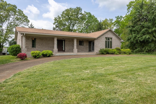 139 County Road 147, Riceville, TN 37370 - single story home featuring brick siding, a front yard, and curved driveway