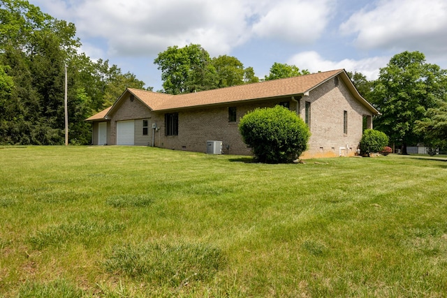 139 County Road 147, Riceville, TN 37370 - view of side of property with a lawn, brick siding, central AC unit, crawl space, and an attached garage