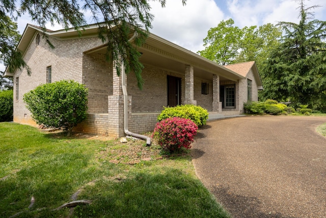 139 County Road 147, Riceville, TN 37370 - view of front of house featuring brick siding and a front yard