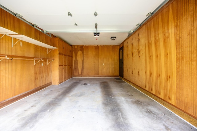 139 County Road 147, Riceville, TN 37370 - garage featuring a garage door opener and wooden walls