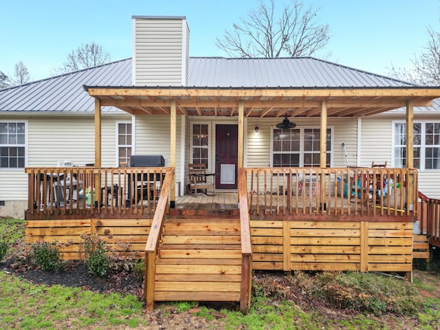 wooden deck featuring area for grilling