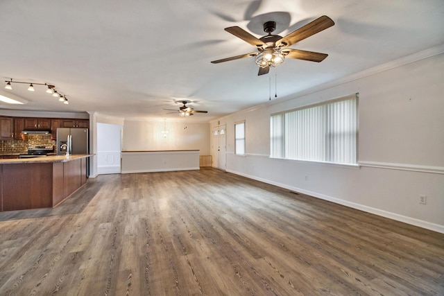 unfurnished living room featuring ceiling fan, dark hardwood / wood-style flooring, and crown molding