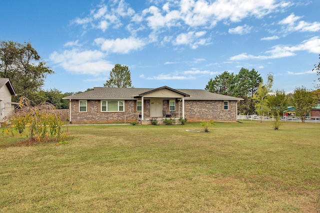 single story home with a front yard