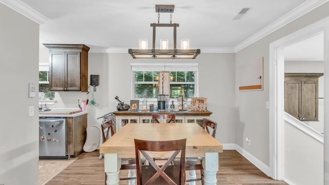 1813 White Oak Valley Rd, Cleveland, TN 37312 - dining room with light wood finished floors and crown molding