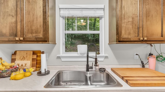 1813 White Oak Valley Rd, Cleveland, TN 37312 - kitchen featuring a sink and brown cabinetry
