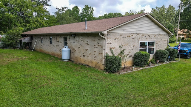 view of property exterior with a yard