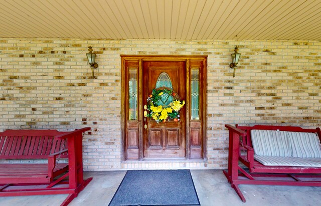 doorway to property featuring a porch