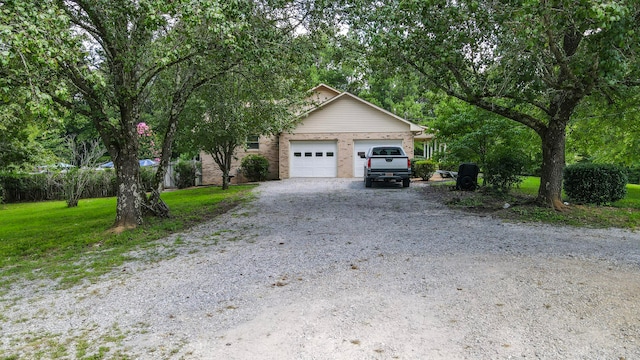 view of front of house with a front lawn and a garage