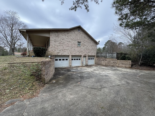 view of side of property with a garage