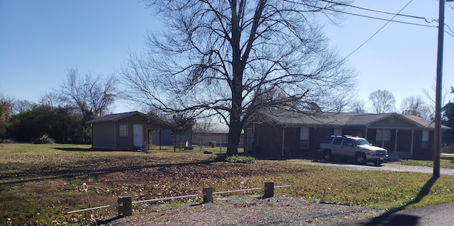 view of side of home featuring a lawn