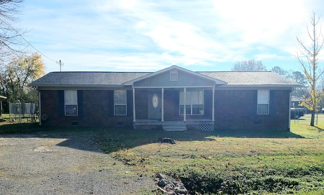 single story home with a sunroom and a front lawn