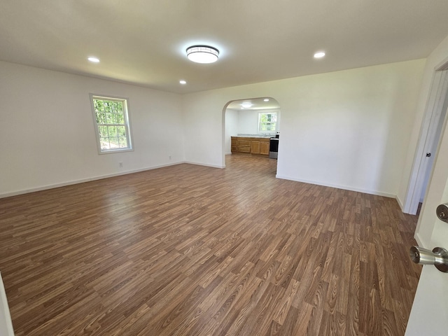 spare room with dark hardwood / wood-style floors