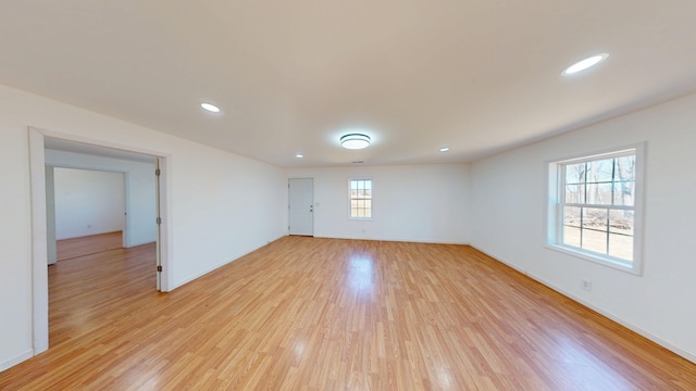 spare room with light wood-style floors and recessed lighting