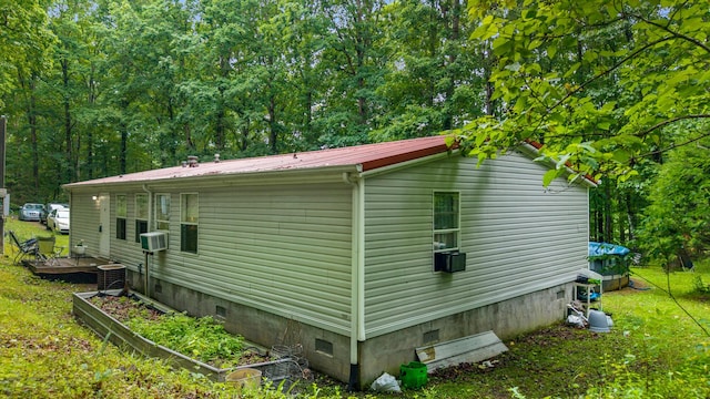 1426 Nebo Rd, Ten Mile, TN 37880 - view of side of property with crawl space, metal roof, cooling unit, and a yard