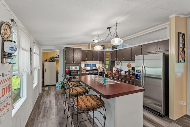 1426 Nebo Rd, Ten Mile, TN 37880 - kitchen with stainless steel appliances, a sink, dark countertops, dark wood finished floors, and healthy amount of natural light