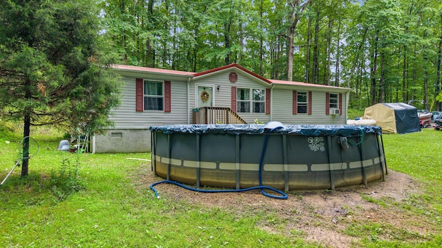 1426 Nebo Rd, Ten Mile, TN 37880 - back of property with a lawn and a covered pool