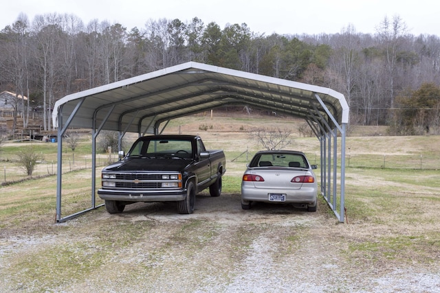 view of car parking with a lawn and a carport