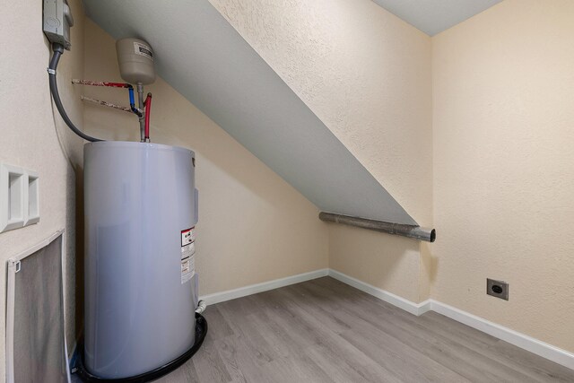 utility room with electric water heater