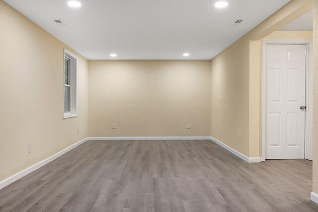 spare room featuring light wood-type flooring