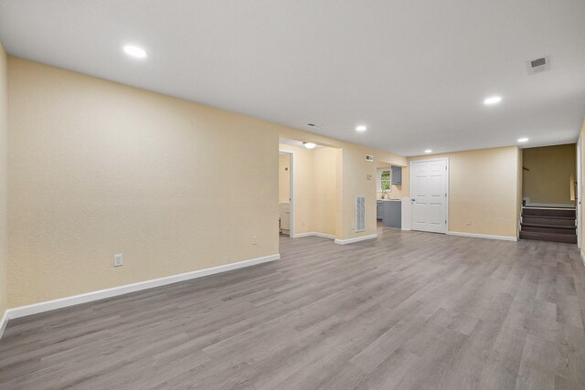 unfurnished living room with light hardwood / wood-style flooring