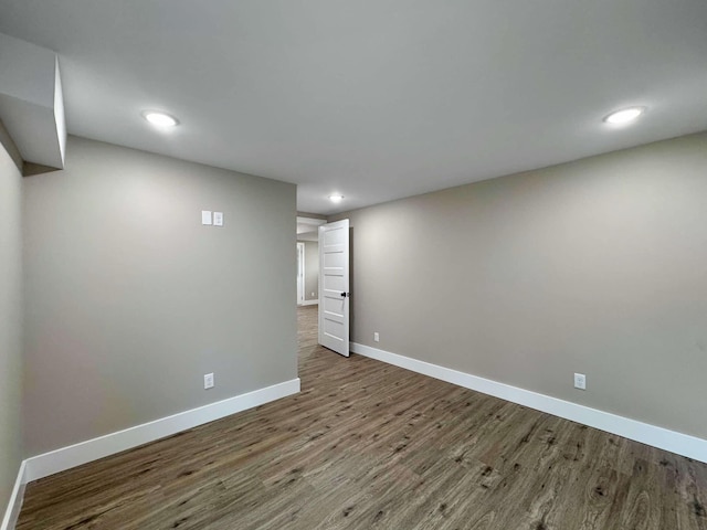 basement with hardwood / wood-style flooring