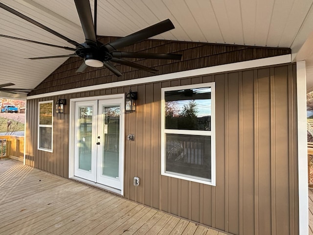 wooden deck with ceiling fan and french doors