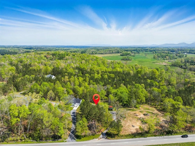 drone / aerial view with a view of trees