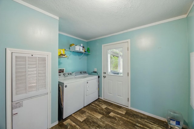 washroom with ornamental molding, a textured ceiling, independent washer and dryer, laundry area, and dark wood finished floors
