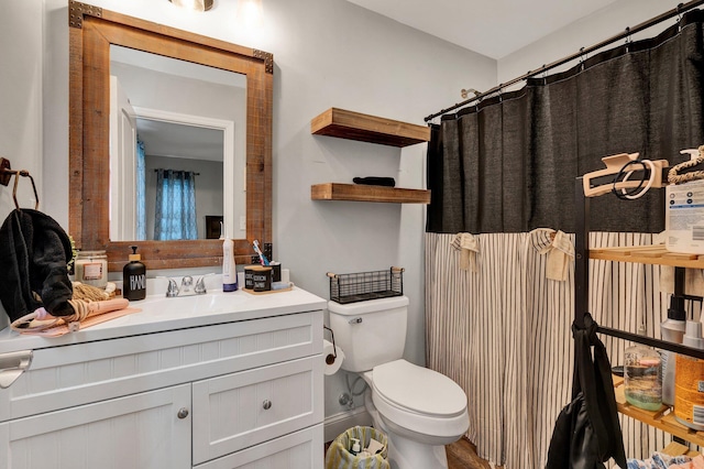 1042 Mccann Dr SE, Cleveland, TN 37311 - bathroom featuring toilet, vanity, and curtained shower