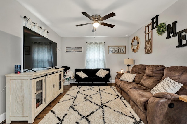 1042 Mccann Dr SE, Cleveland, TN 37311 - living area with dark wood-type flooring, ceiling fan, and baseboards