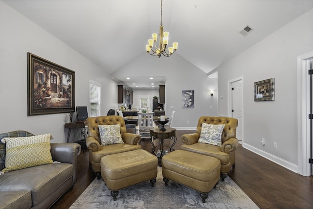 living room with a notable chandelier, dark hardwood / wood-style flooring, and lofted ceiling