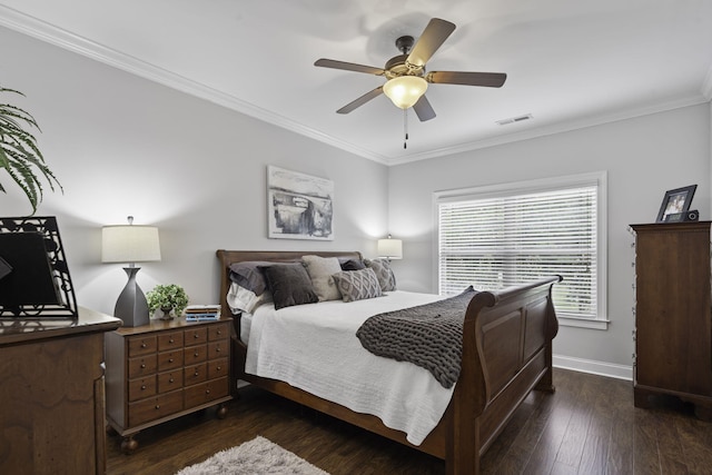 bedroom featuring ceiling fan, ornamental molding, and dark wood-type flooring