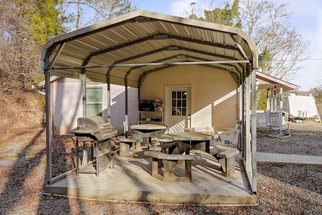 view of patio / terrace featuring a carport and grilling area