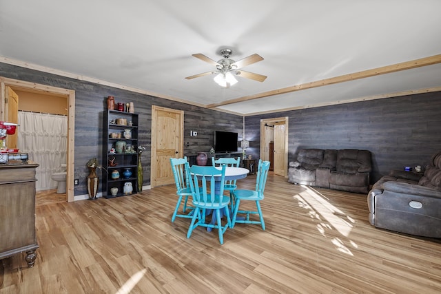 dining room with ceiling fan and hardwood / wood-style flooring