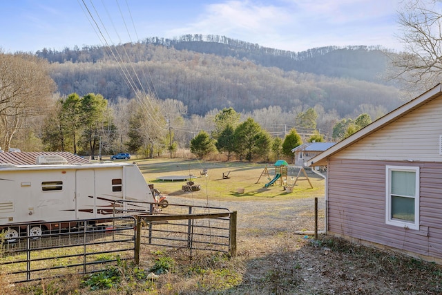 exterior space featuring a mountain view and a playground