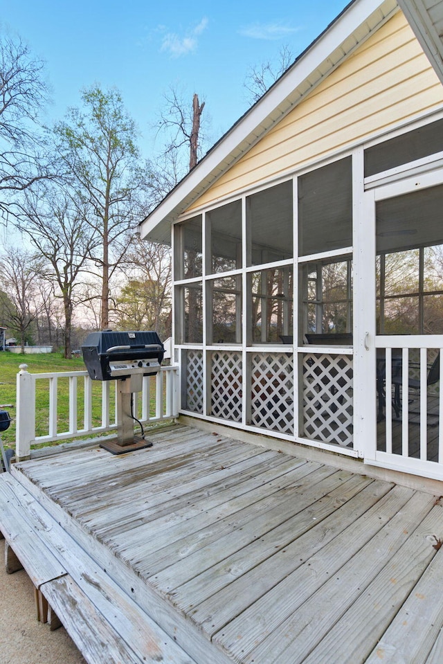 7701 Diamondhead Dr, Ooltewah, TN 37363 - wooden deck featuring a sunroom and grilling area