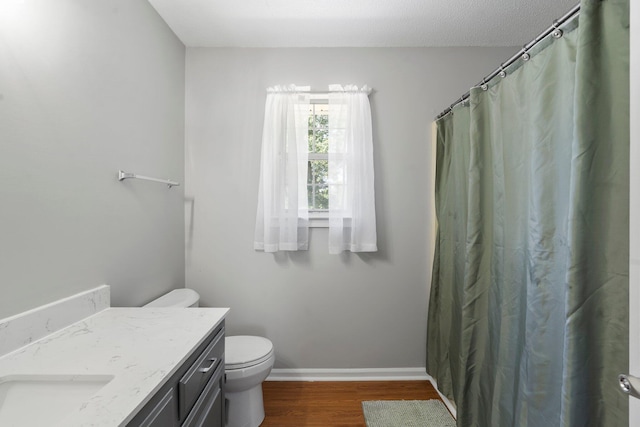 7701 Diamondhead Dr, Ooltewah, TN 37363 - full bathroom with wood finished floors, vanity, and a shower with curtain