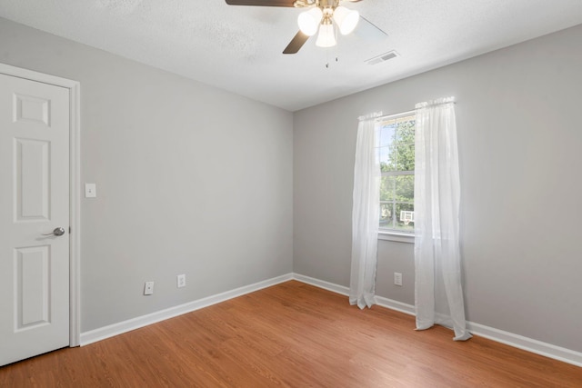 7701 Diamondhead Dr, Ooltewah, TN 37363 - empty room featuring light wood finished floors and ceiling fan