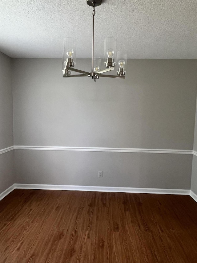 7701 Diamondhead Dr, Ooltewah, TN 37363 - spare room with dark wood-style floors and a textured ceiling