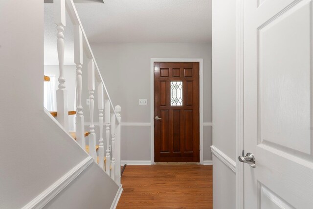 7701 Diamondhead Dr, Ooltewah, TN 37363 - entryway with wood finished floors and stairs