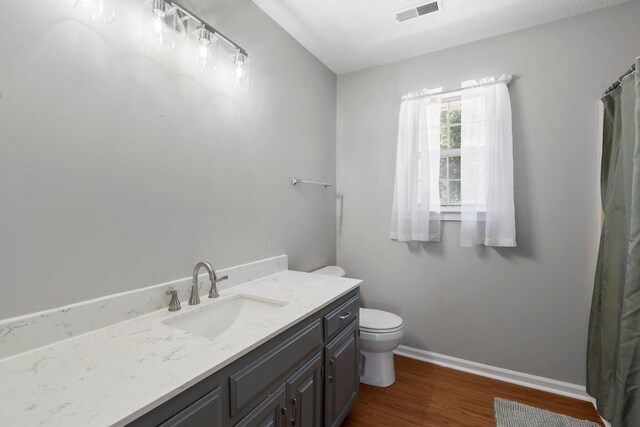 7701 Diamondhead Dr, Ooltewah, TN 37363 - bathroom with vanity, wood finished floors, and curtained shower