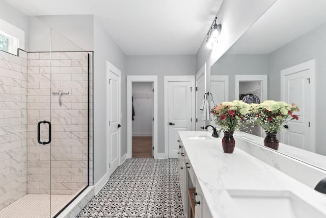 1786 Welcome Valley Rd, Benton, TN 37307 - full bath featuring a shower stall, tile patterned floors, a walk in closet, vanity, and baseboards