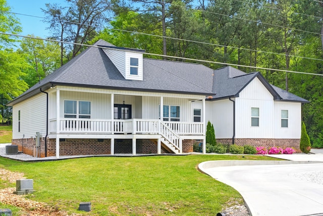 1786 Welcome Valley Rd, Benton, TN 37307 - view of front facade with a front lawn, covered porch, roof with shingles, and central AC